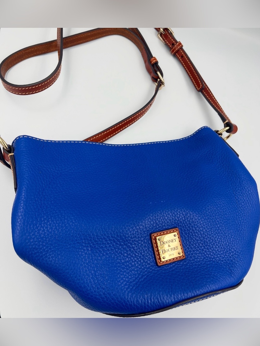 Dooney & Bourke Cobalt Blue Pebbled Leather Crossbody with Brown Strap